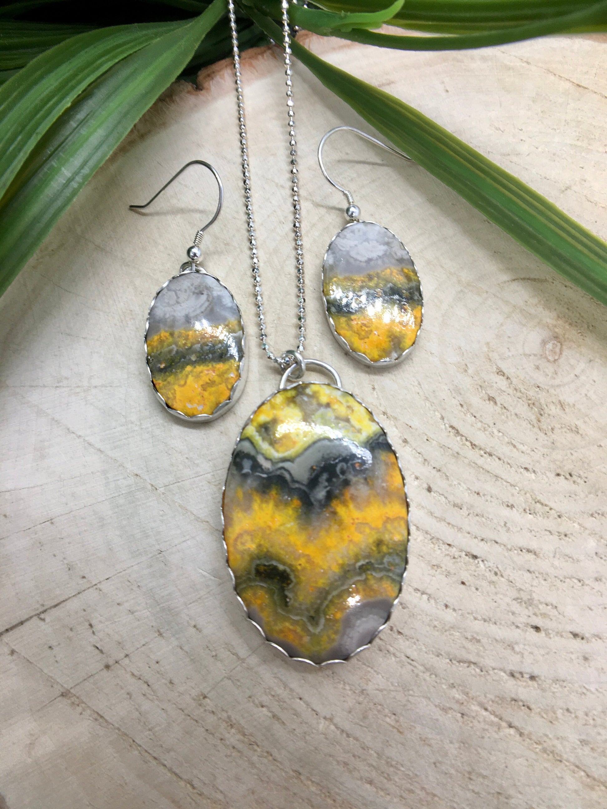 Handmade sterling silver necklace and dangle earring set featuring bumblebee jasper gemstones.